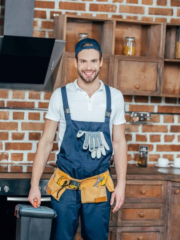 professional-home-master-with-toolbox-and-tool-belt-smiling-at-camera.jpg