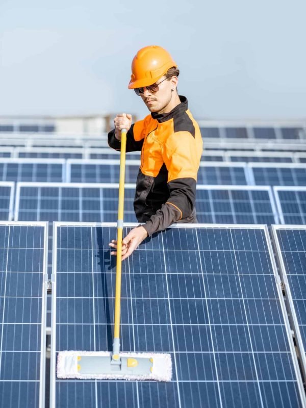 workman-cleaning-solar-panels.jpg